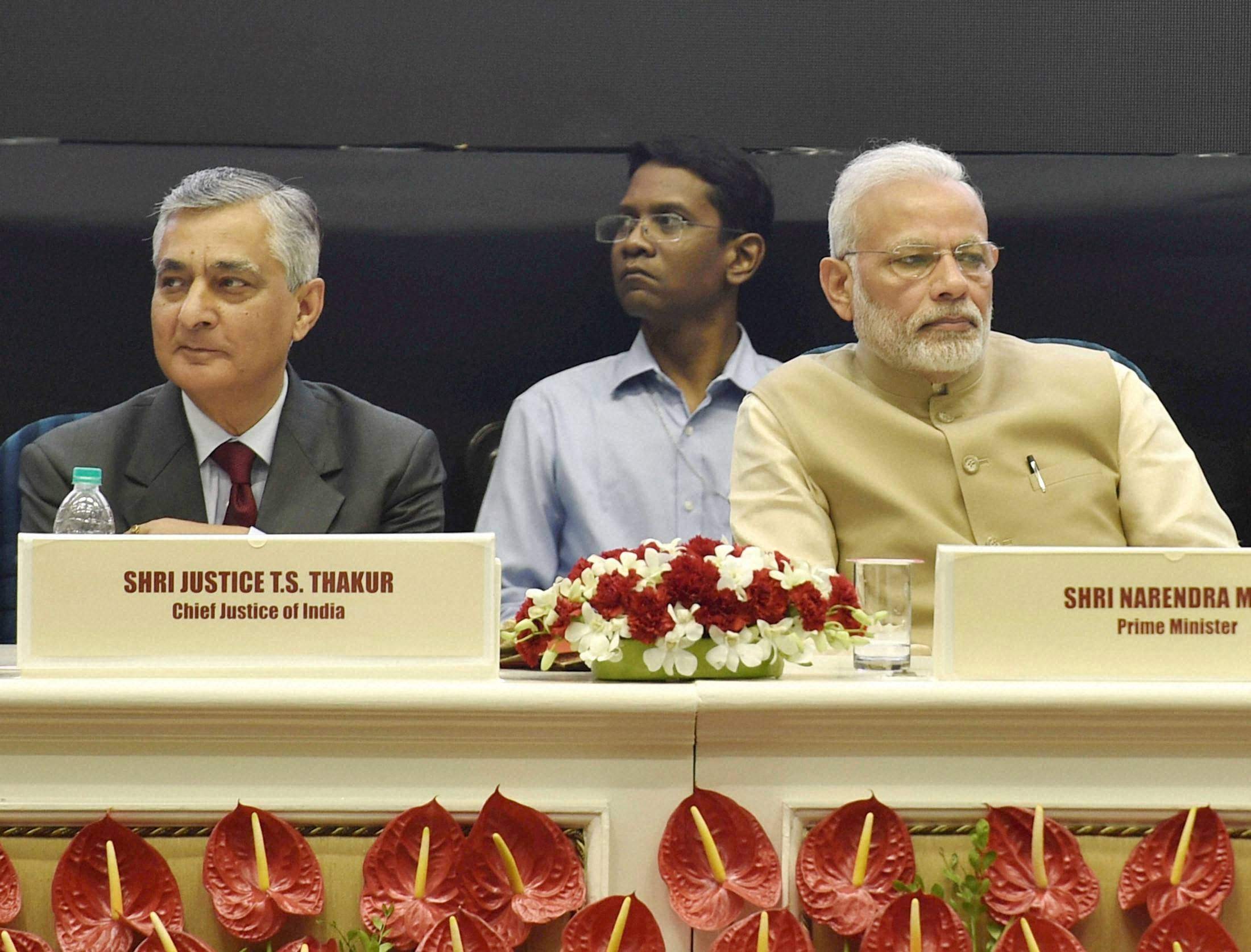 Prime Minister Narendra Modi and Chief Justice of India TS Thakur during the 50th anniversary function of establishment of the High Court of Delhi. Photo: PTI Prime Minister Narendra Modi and Chief Justice of India TS Thakur during the 50th anniversary function of establishment of the High Court of Delhi. Photo: PTI
