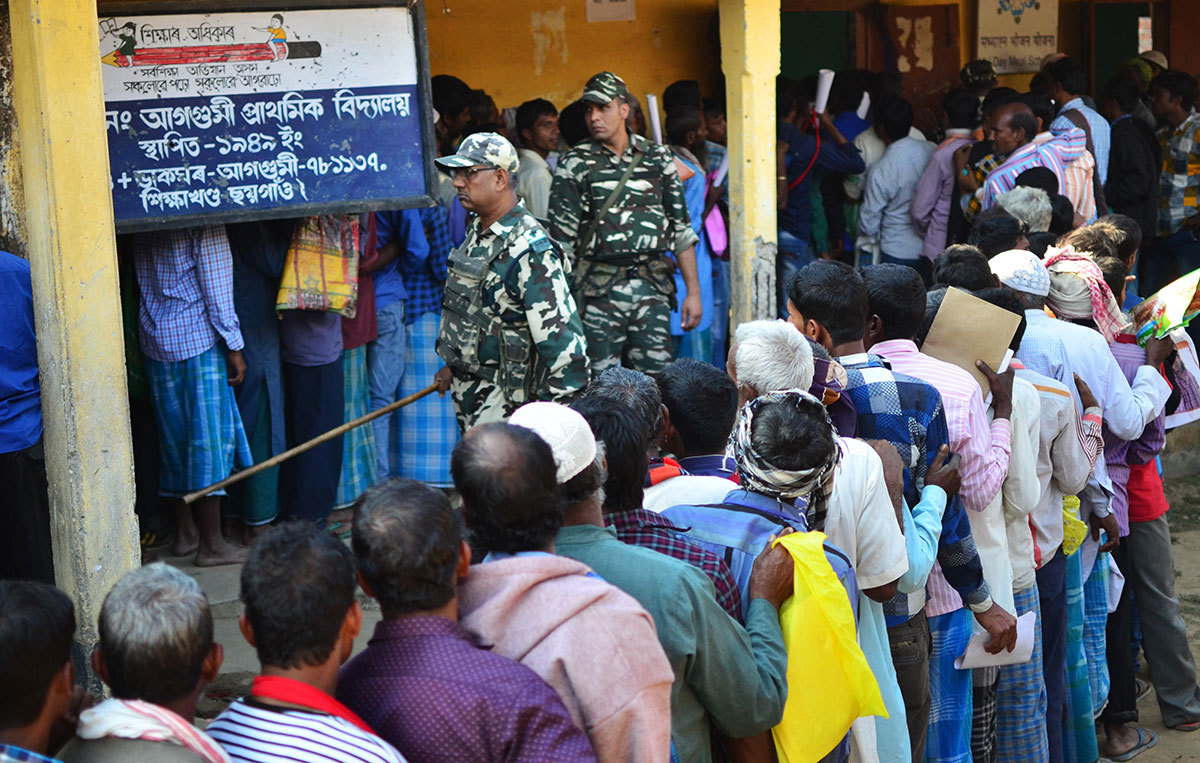 People stand in line to check their names on the first draft of the National Register of Citizens at Gumi village in Kamrup, Assam. Photo credit: AFP People stand in line to check their names on the first draft of the National Register of Citizens at Gumi village in Kamrup, Assam. Photo credit: AFP