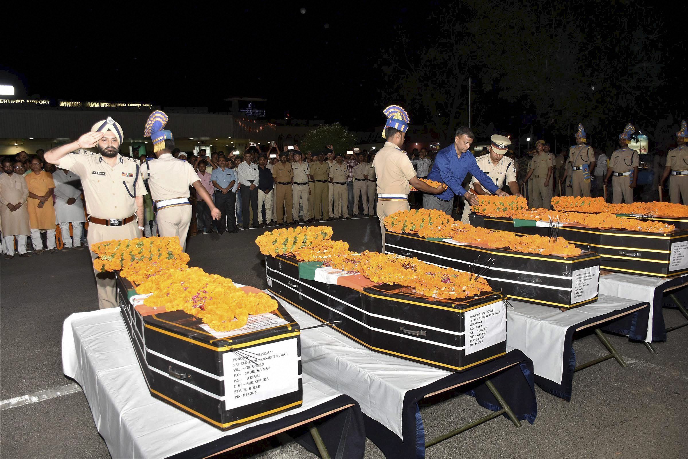 CRPF officers pay tributes to slain jawans at Patna airport. Image credit: PTI CRPF officers pay tributes to slain jawans at Patna airport. Image credit: PTI