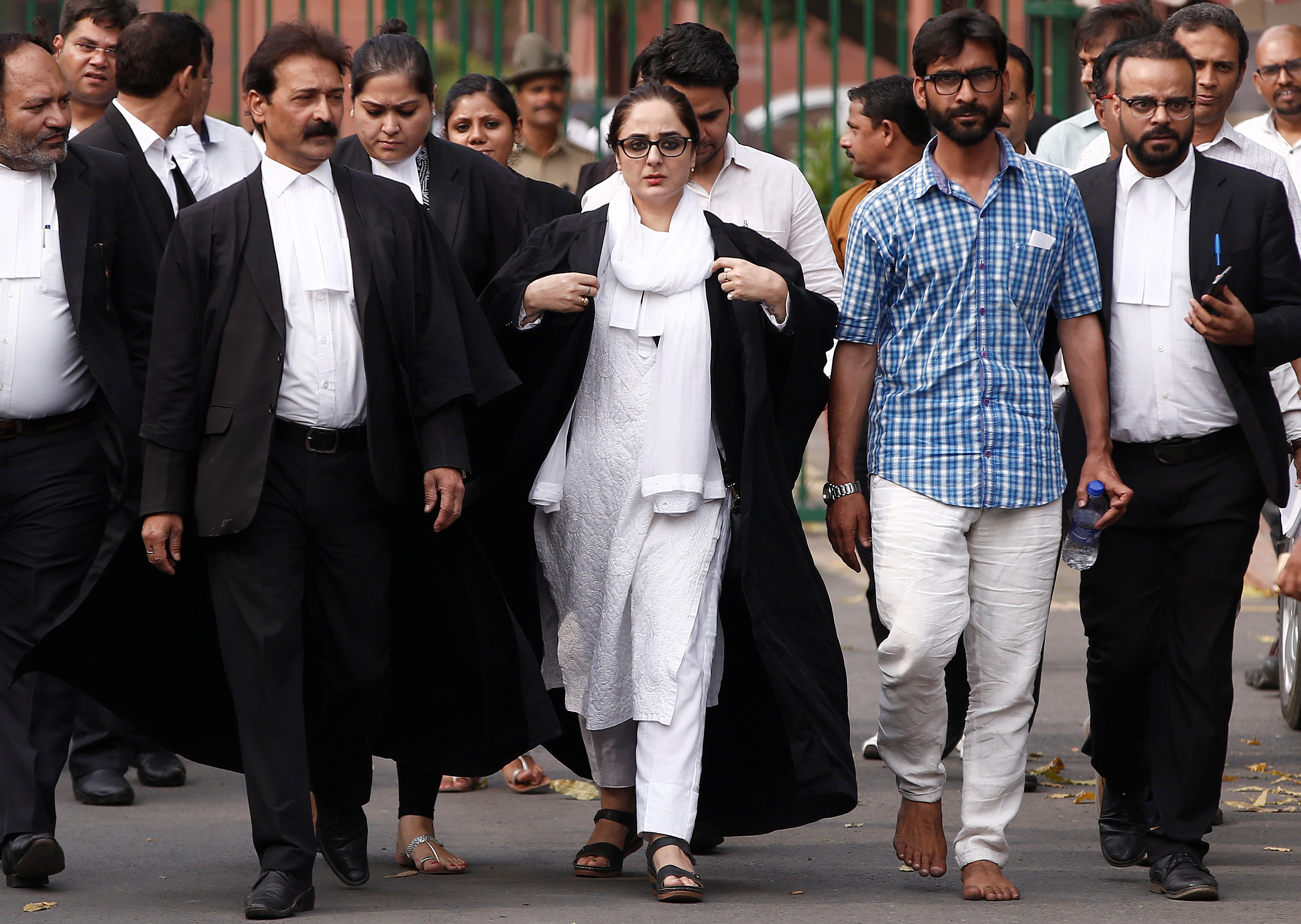 Talib Hussain, second right, with Deepika Singh Rajawat, the lawyer representing the Kathua victim's family. Photo credit: Reuters Talib Hussain, second right, with Deepika Singh Rajawat, the lawyer representing the Kathua victim's family. Photo credit: Reuters